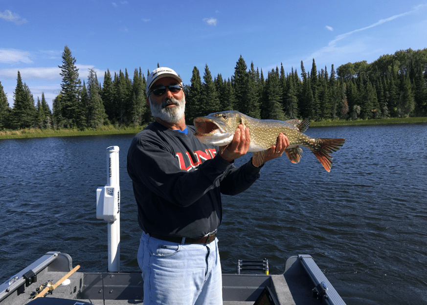 Old Man Holding A Fish