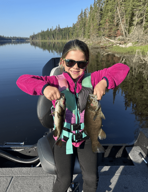 Young Girl Holding A Fish